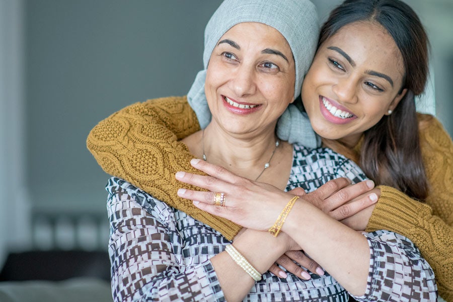 Cancer patient sitting outside with her daughter