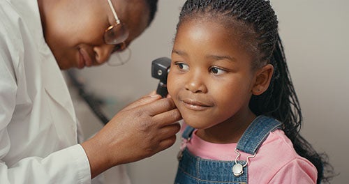 Child getting ear inspected in-office