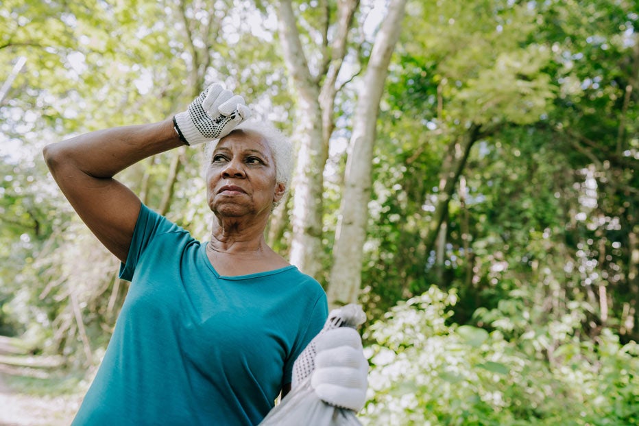 Tired senior woman working outside