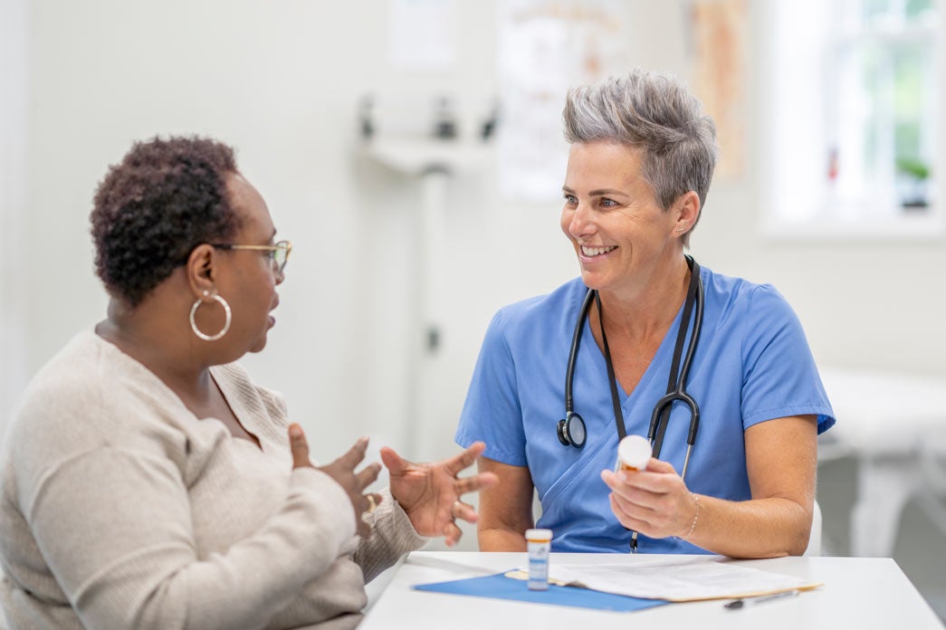 Woman asking friendly provider question about medication