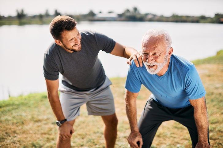 Man and father resting while exercising
